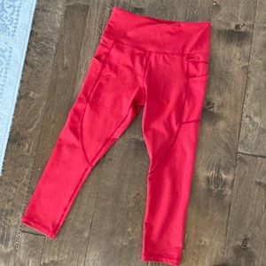 Red Zyia leggings with pockets